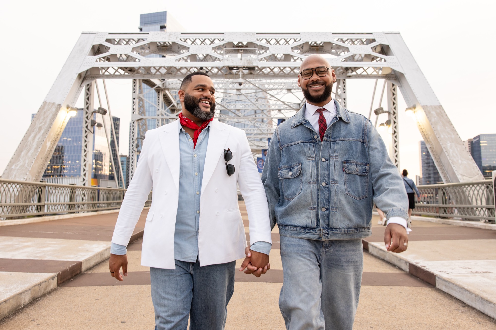 Aaron and Deonte walking hand in hand across the Shelby Street pedestrian bridge