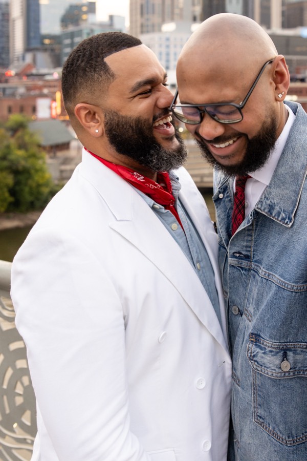 Laughing together on a rooftop overlooking downtown Nashville