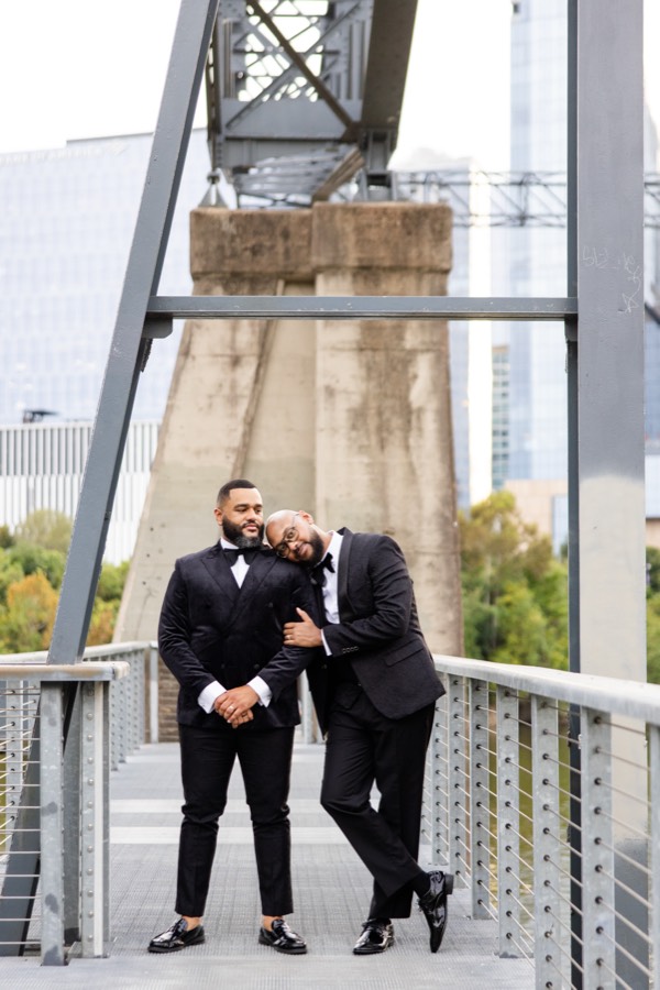Deonte leaning his head on Aaron's shoulder on the bridge
